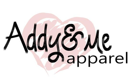 Logo of Addy & Me Apparel with a pink heart on a white background